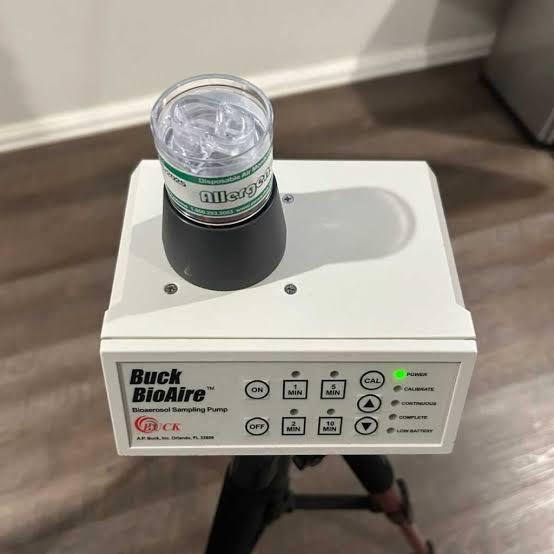 Buck BioAire pump, cassette on top, handheld — real inspection